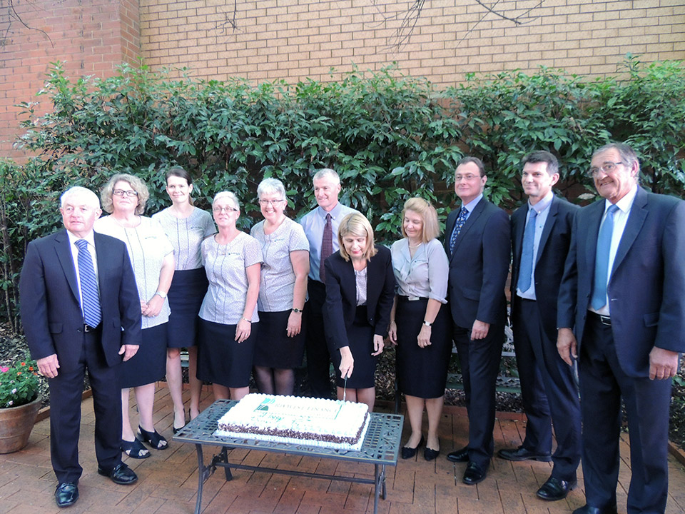 Rivwest staff and directors cutting the cake to celebrate 21 years